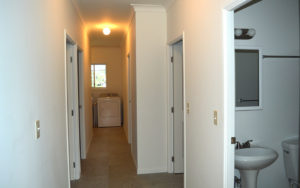 2 bathrooms on right, rooms down the hall